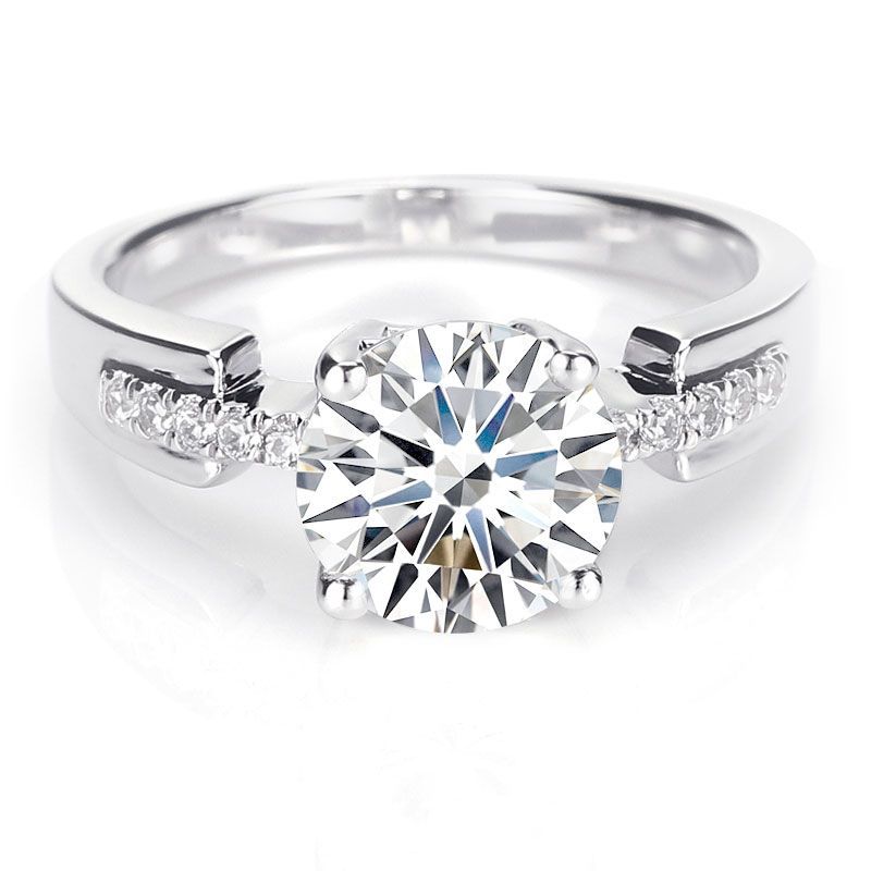 Four Prong Round Brilliant cut White Sapphire Engagement Ring