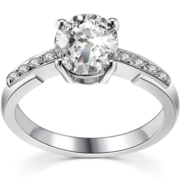 Four Prong Round Brilliant cut White Sapphire Engagement Ring