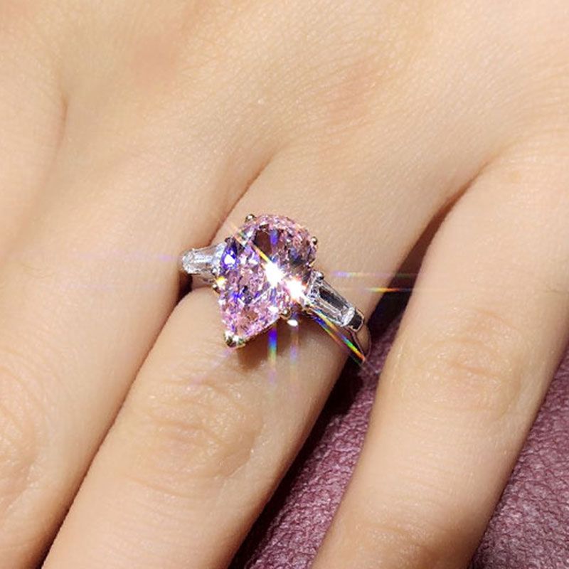 Two Tone Three Stone Pear Cut Created Pink Sapphire Sterling Silver Ring